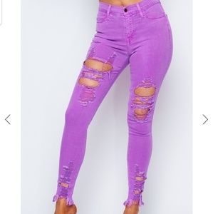 Neon purple distressed jeans